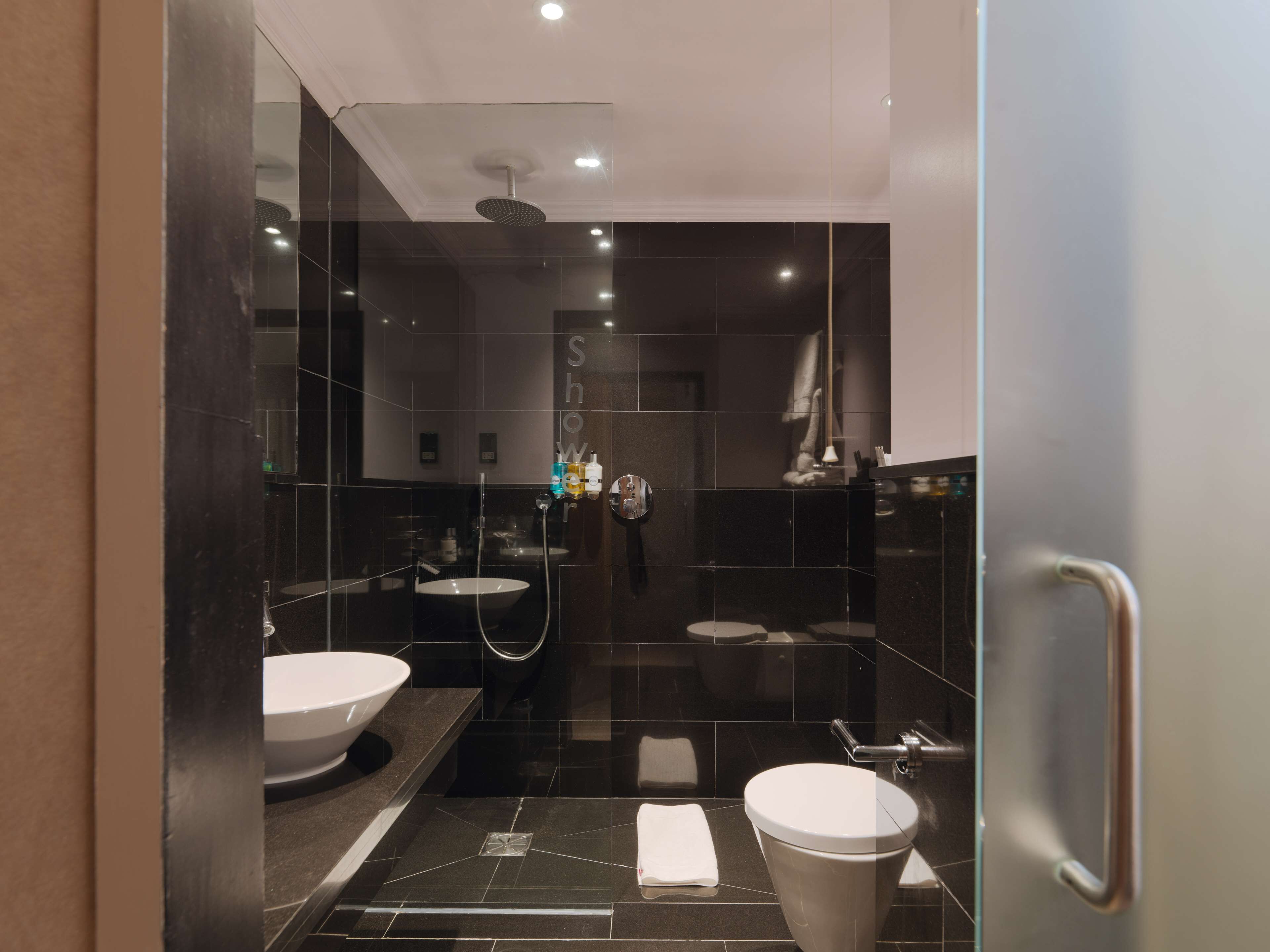 superior room | bathroom | shower, designer toiletries, hair dryer, towels