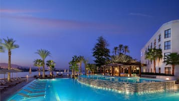 2 outdoor pools, open 9:00 AM to 10:00 PM, pool umbrellas, pool loungers