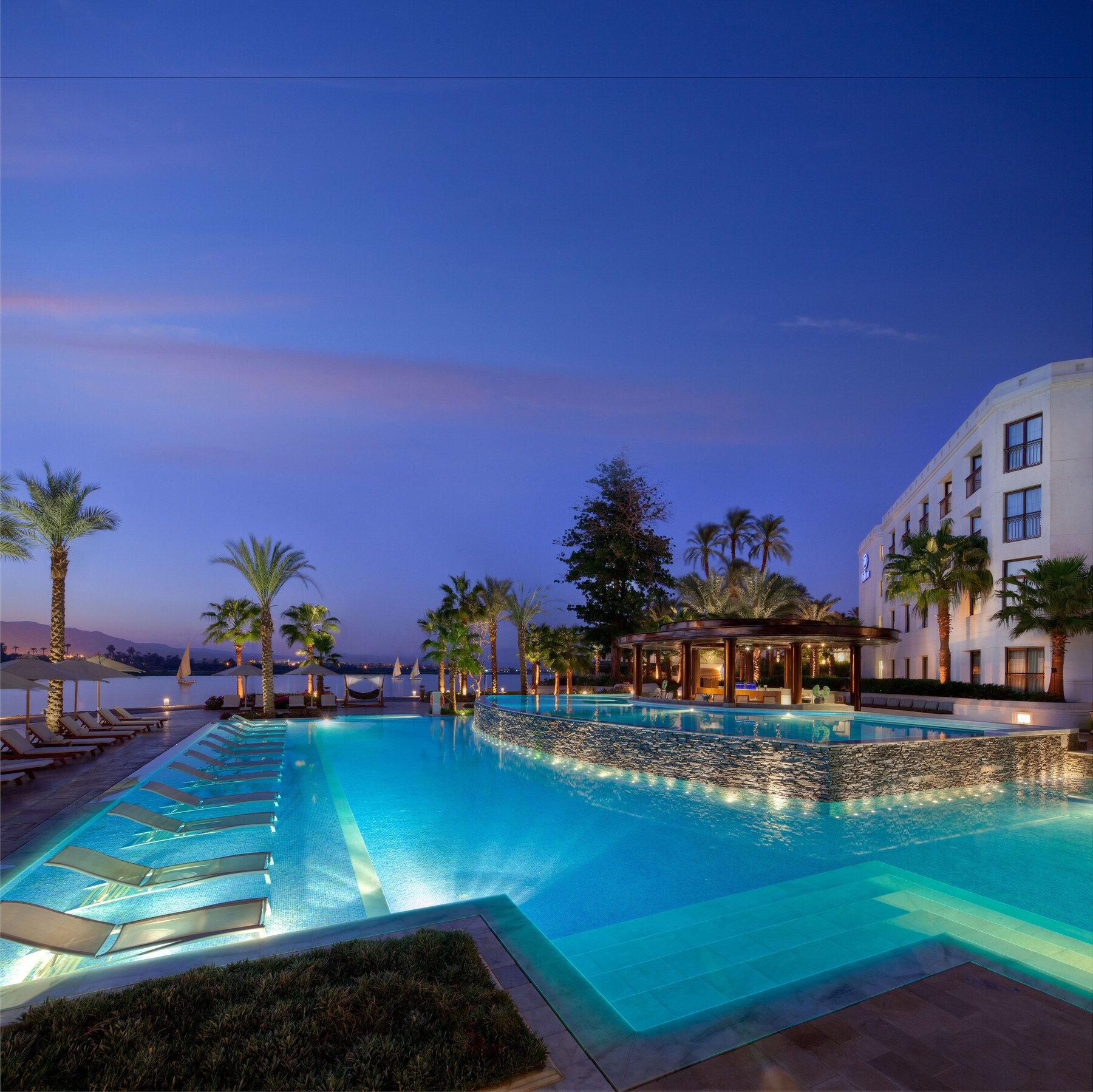 2 outdoor pools, open 9:00 AM to 10:00 PM, pool umbrellas, sun loungers