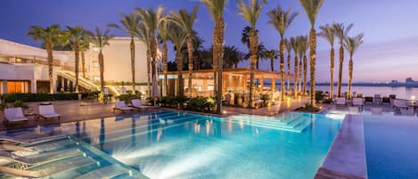 2 outdoor pools, open 9:00 AM to 10:00 PM, pool umbrellas, pool loungers