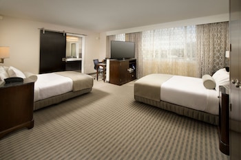 Pillowtop beds, in-room safe, desk, blackout drapes at Skybridge Seattle Airport Hotel