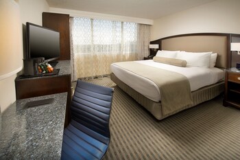 Pillowtop beds, in-room safe, desk, laptop workspace at Skybridge Seattle Airport Hotel