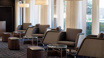 Relax in our inviting lobby with comfortable seating areas and stylish glass-top tables.