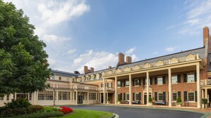 A large, historic building with a central courtyard, columns, and a brick facade. - The Carolina Inn, a Destination by Hyatt Hotel (Chapel Hill)