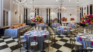 A banquet hall with round tables, chandeliers, and floral centerpieces. - The Carolina Inn, a Destination by Hyatt Hotel (Chapel Hill)