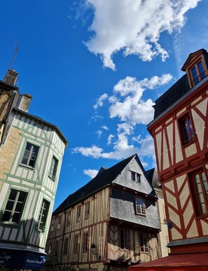 A traditional half-timbered building with a steep gabled roof and a visible chimney. - Hotel ibis Vannes (Vannes)