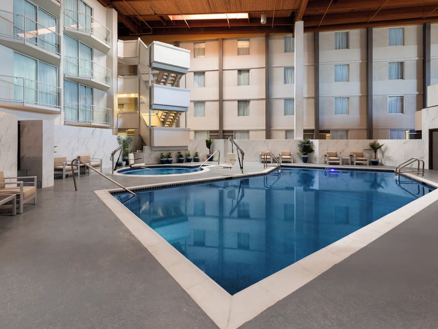 Indoor pool, seasonal outdoor pool, pool umbrellas, sun loungers