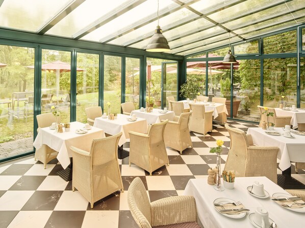 Breakfast, lunch served; international cuisine, al fresco dining