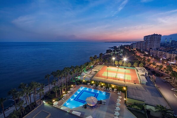 Seasonal outdoor pool, pool umbrellas, pool loungers