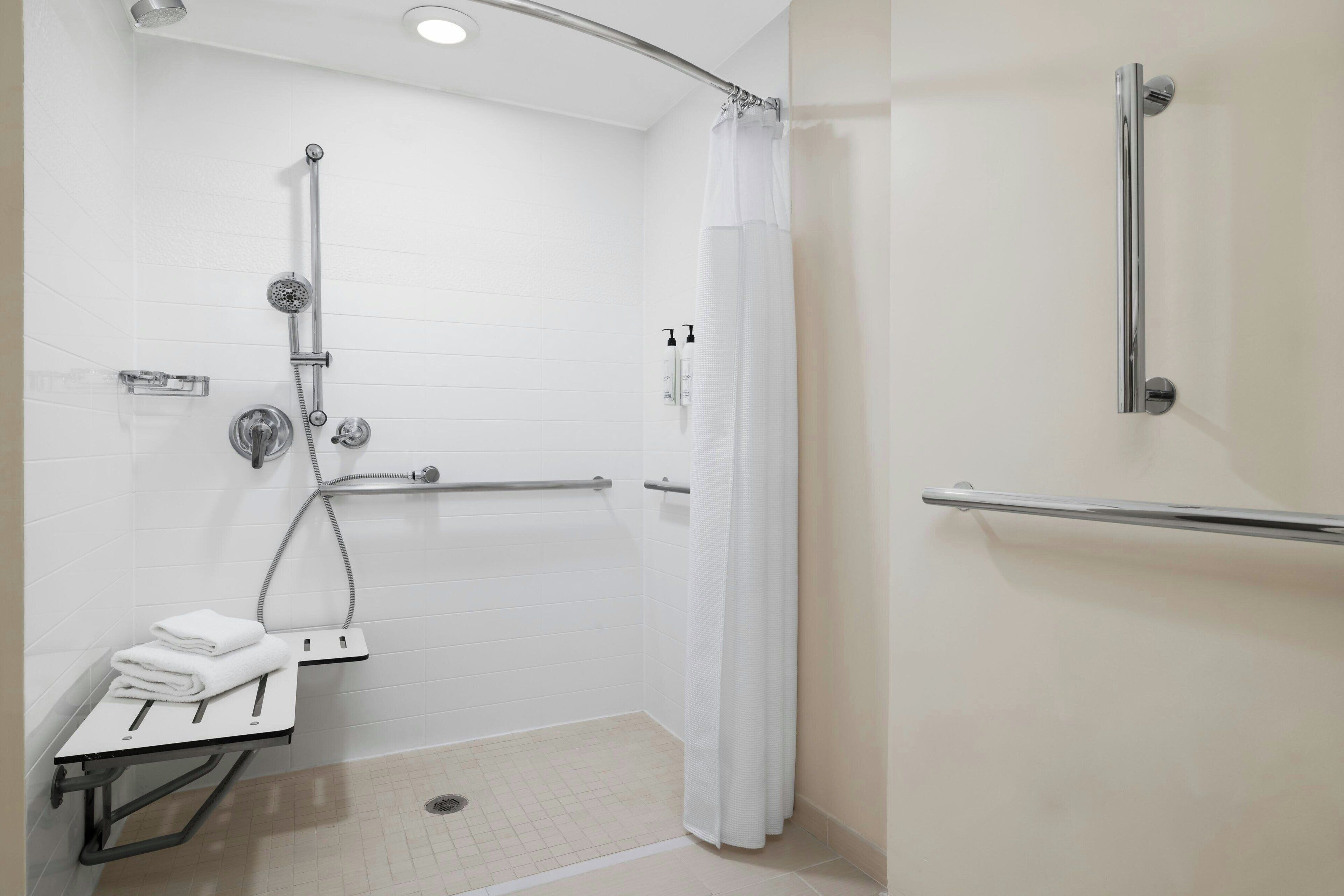 room, 1 king bed (mobility/hearing access, roll-in shwr) | bathroom | shower, free toiletries, hair dryer, towels