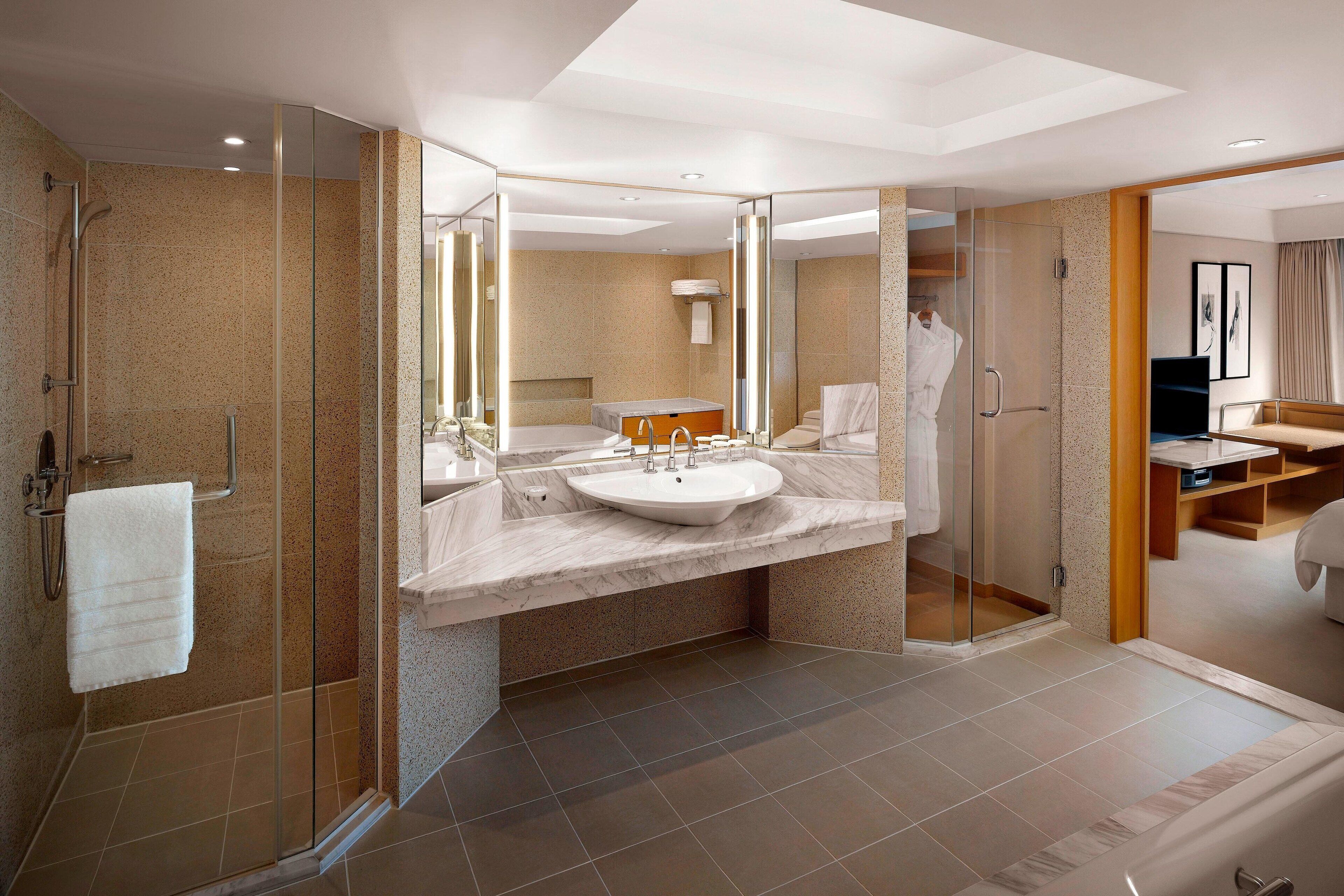 combined shower/bathtub, deep-soaking bathtub, designer toiletries