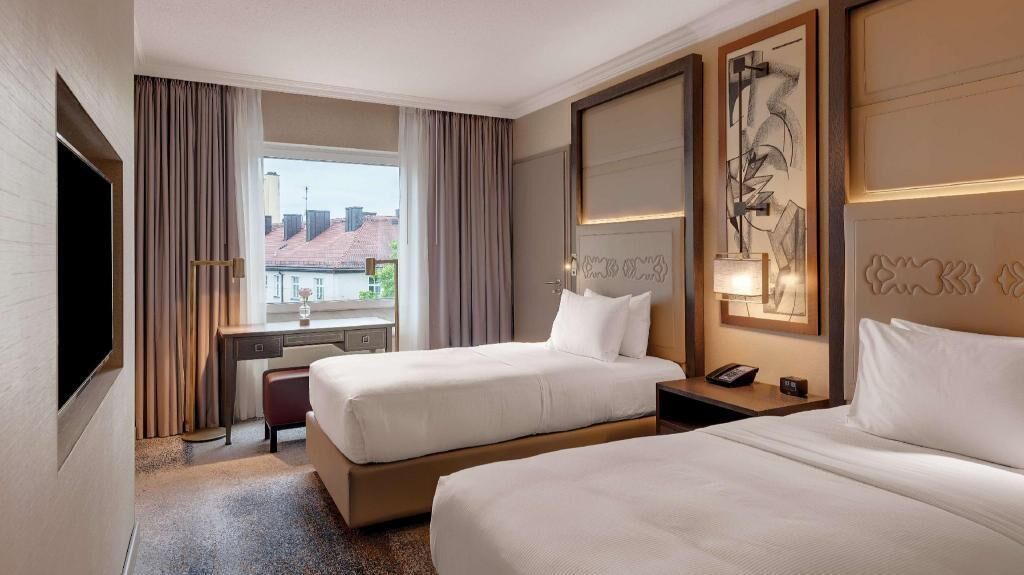 Hypo-allergenic bedding, in-room safe, laptop workspace