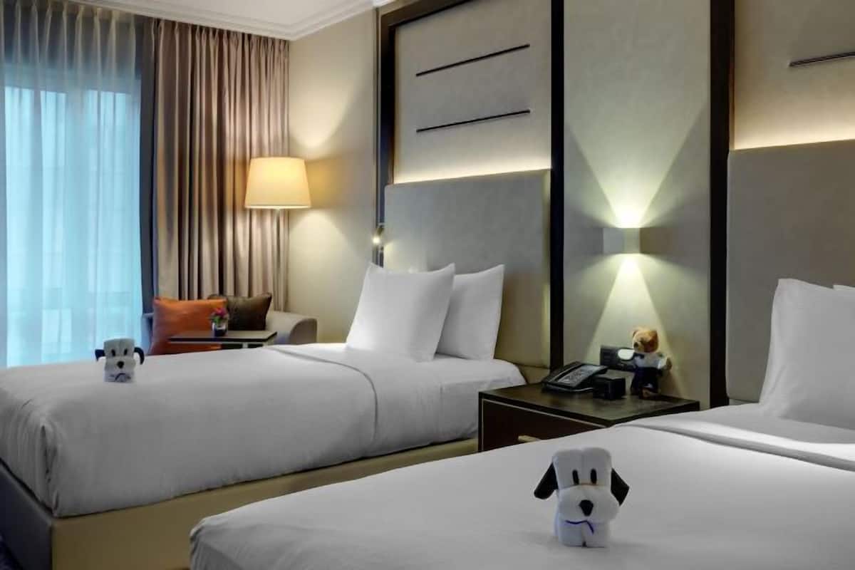 Hypoallergeen beddengoed, een kluis op de kamer, een laptopwerkplek