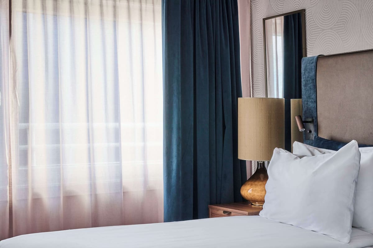 Premium bedding, pillow-top beds, minibar, in-room safe