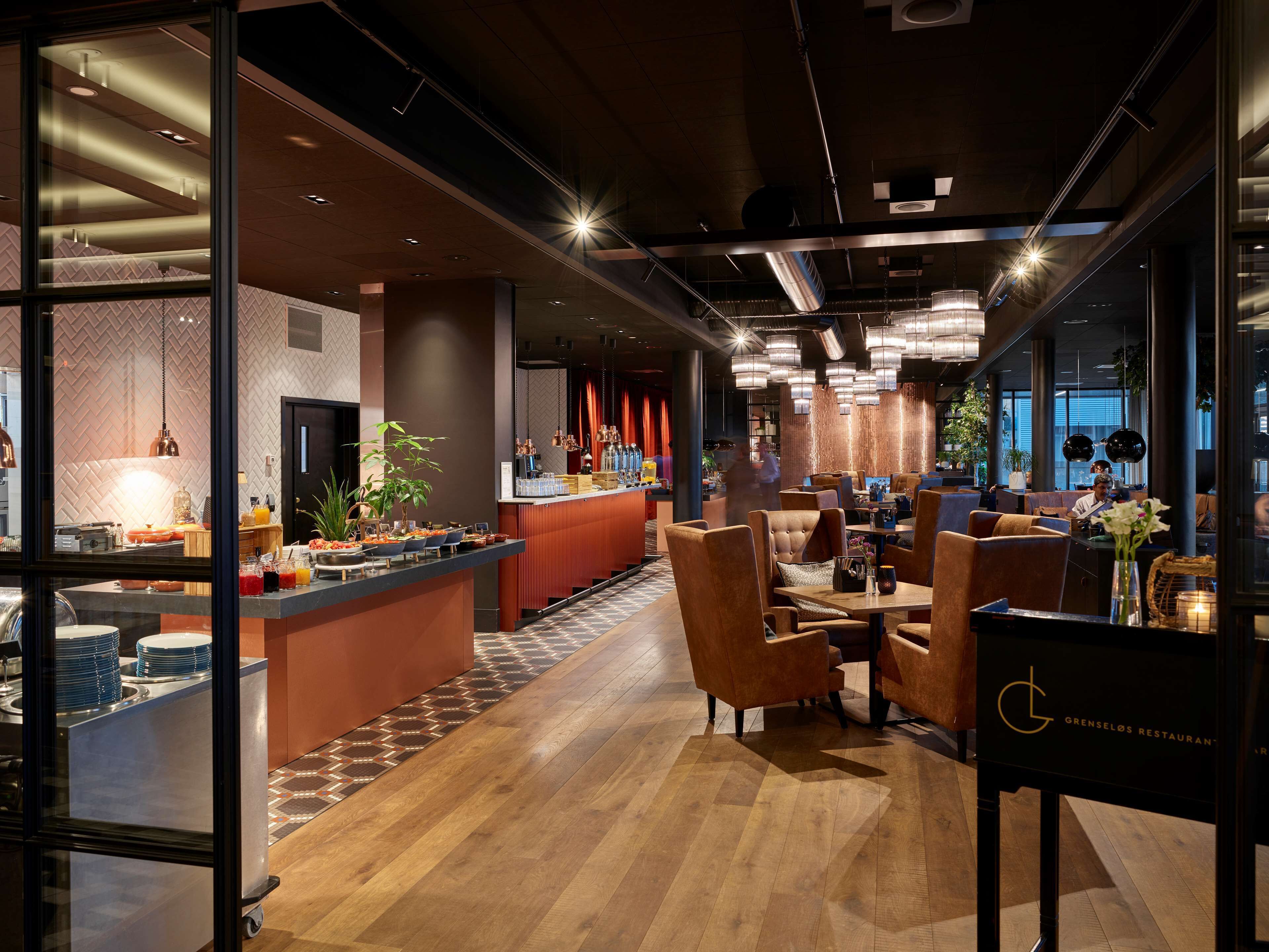 A modern restaurant interior with a bar area, seating, and a visible menu board.
