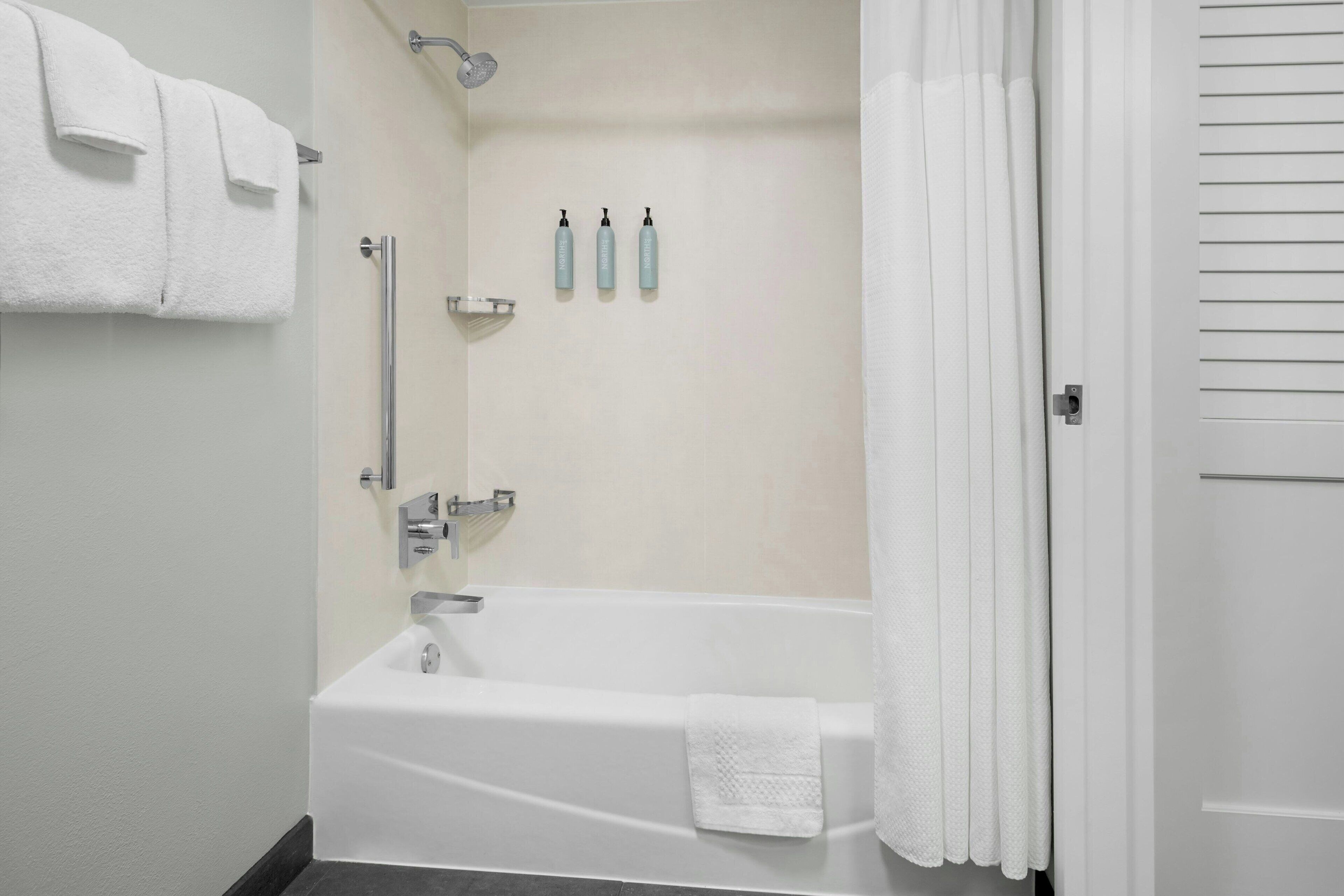 combined shower/bathtub, eco-friendly toiletries, hair dryer, towels