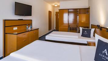 Desk, laptop workspace, bed sheets