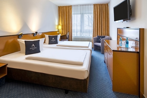 Desk, laptop workspace, bed sheets