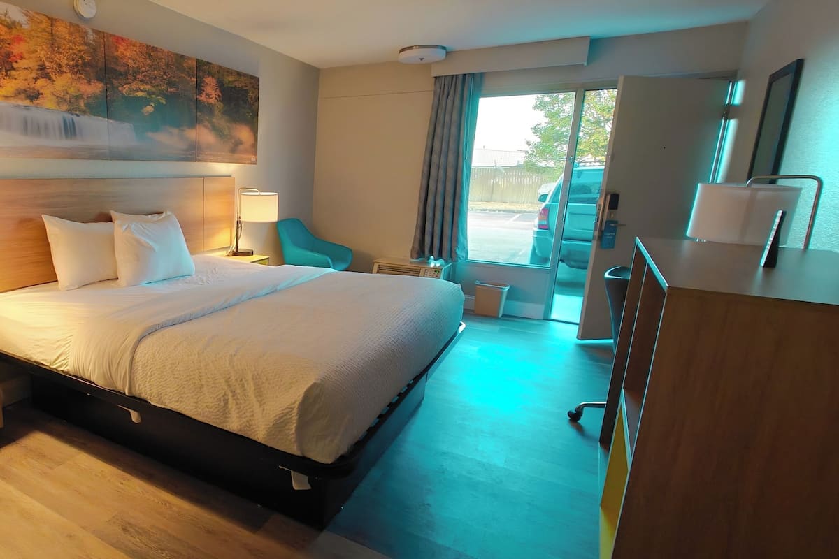Premium bedding, desk, laptop workspace, iron/ironing board