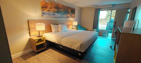 Premium bedding, desk, laptop workspace, iron/ironing board