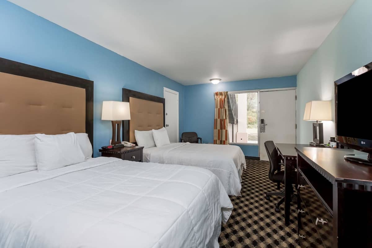 Premium bedding, desk, laptop workspace, iron/ironing board