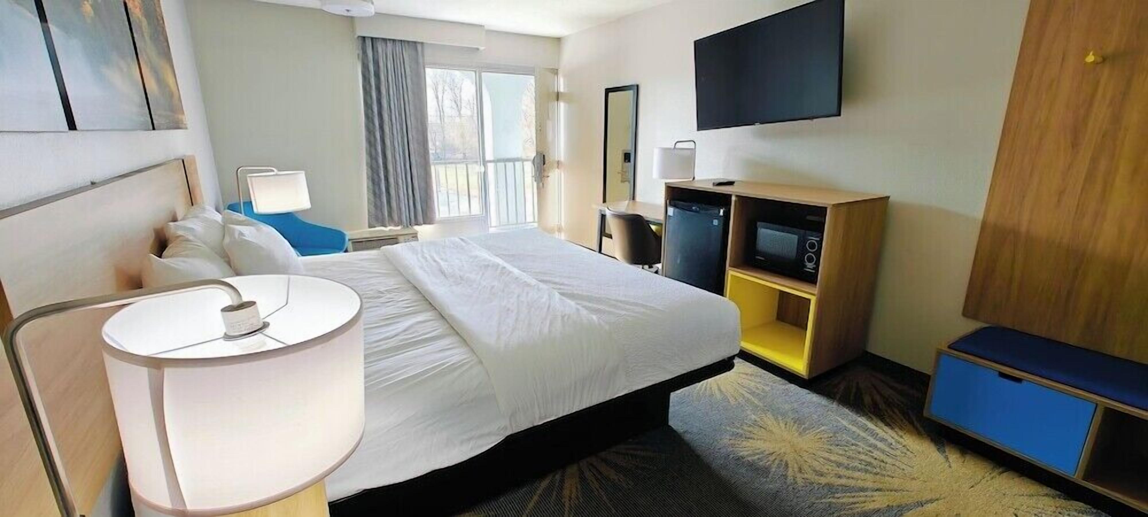 Premium bedding, desk, laptop workspace, iron/ironing board