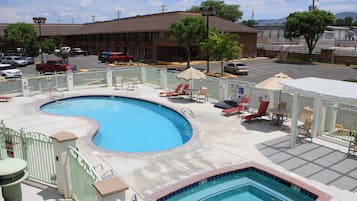 Seasonal outdoor pool, open 8:00 AM to 10:00 PM, pool umbrellas