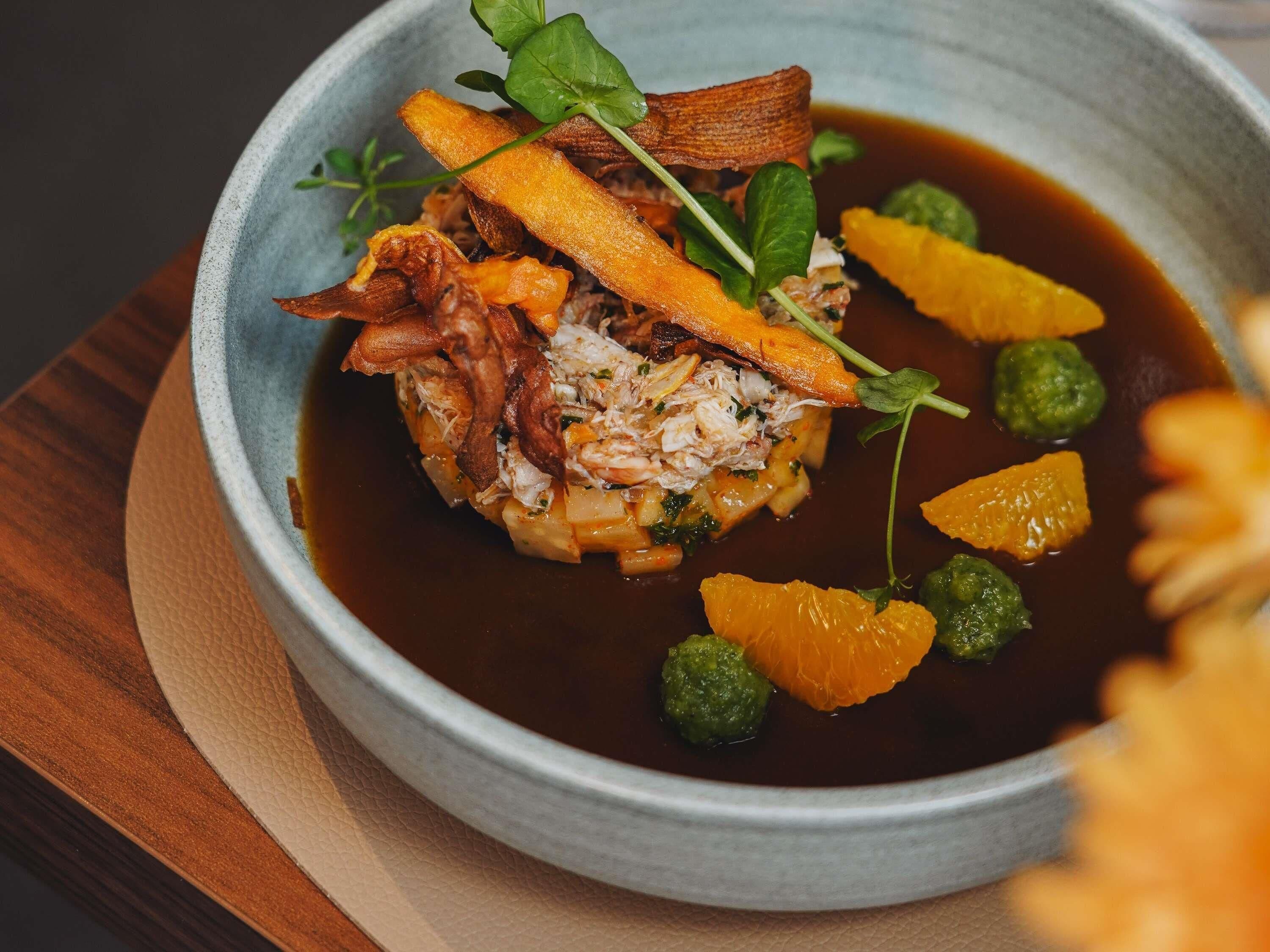 A bowl of food with various ingredients.