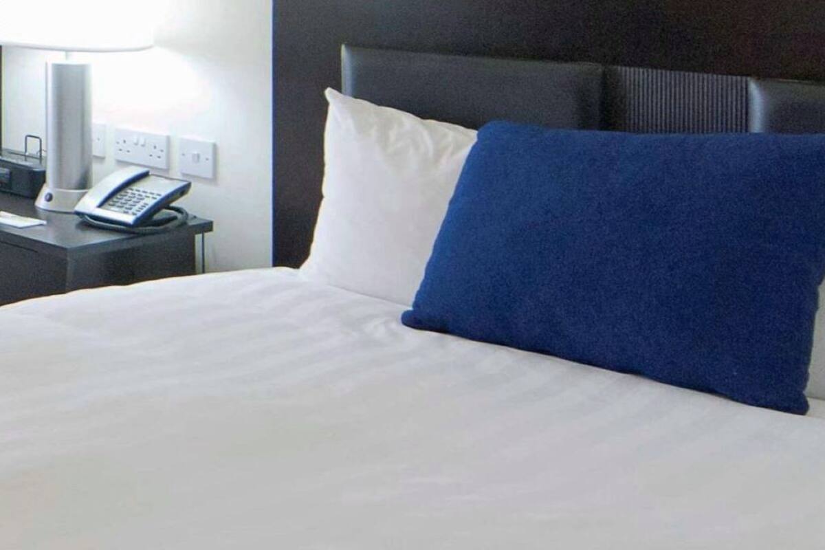 Down comforters, pillowtop beds, in-room safe, desk