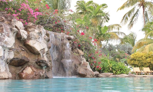 2 outdoor pools, open 10:00 AM to 10 PM, pool umbrellas, pool loungers