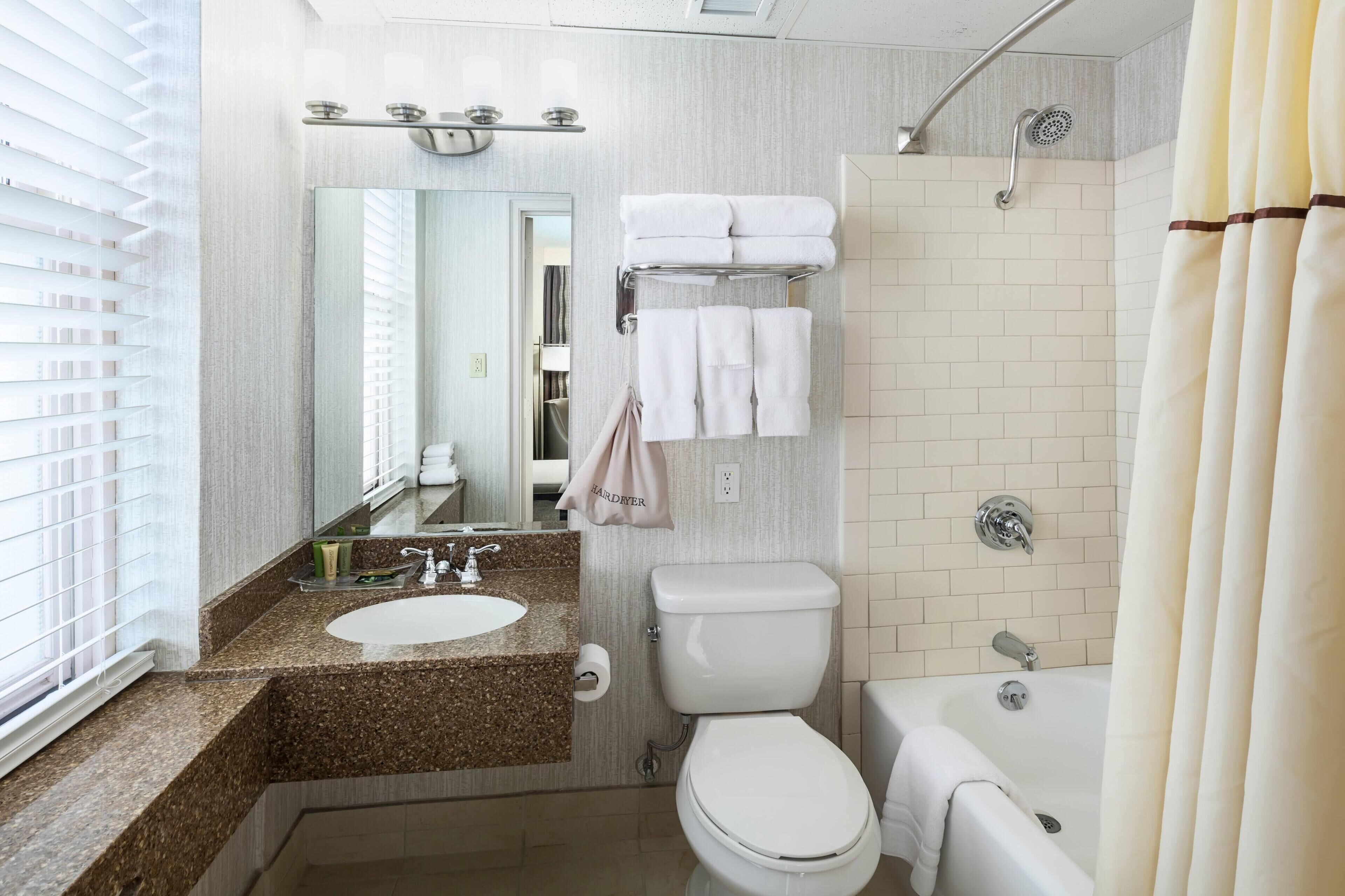 standard room, 2 queen beds, city view | bathroom | free toiletries, hair dryer, towels