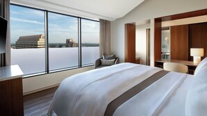 A hotel room with a large bed, a desk, a chair, and a TV. - The Westin Galleria Dallas (Dallas)