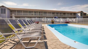 Seasonal outdoor pool, pool loungers