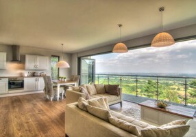 Deluxe Cabin | Living area | Flat-screen TV