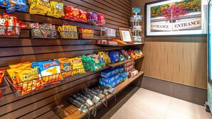 A snack display with various chips and snacks.
