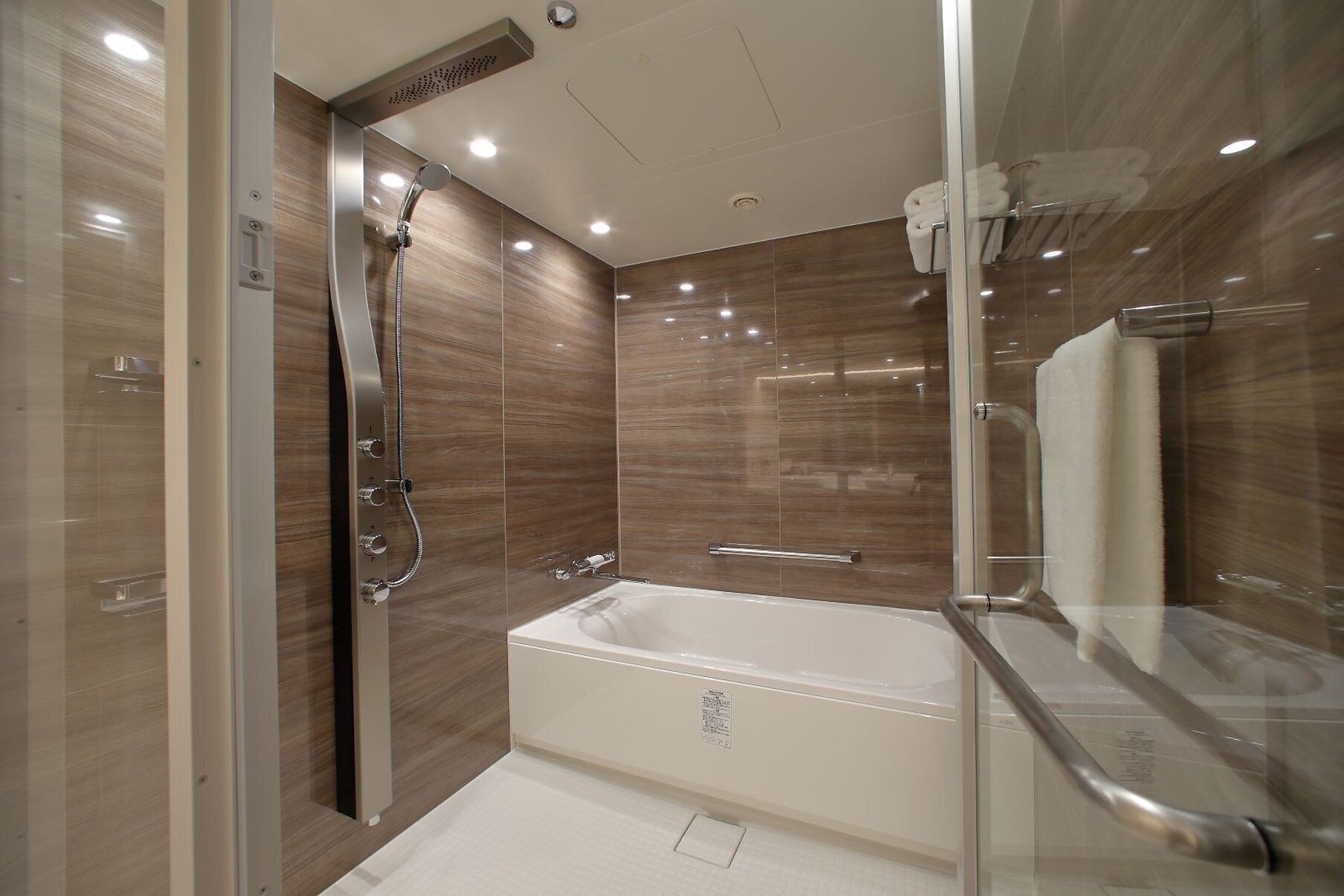 suite, 2 queen beds | bathroom | combined shower/bathtub, rainfall showerhead, designer toiletries