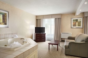 Suite, 1 King Bed, Non Smoking, Jetted Tub | Desk, laptop workspace, iron/ironing board, free WiFi
