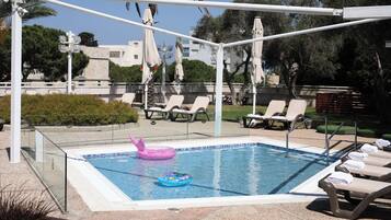 Seasonal outdoor pool, pool umbrellas