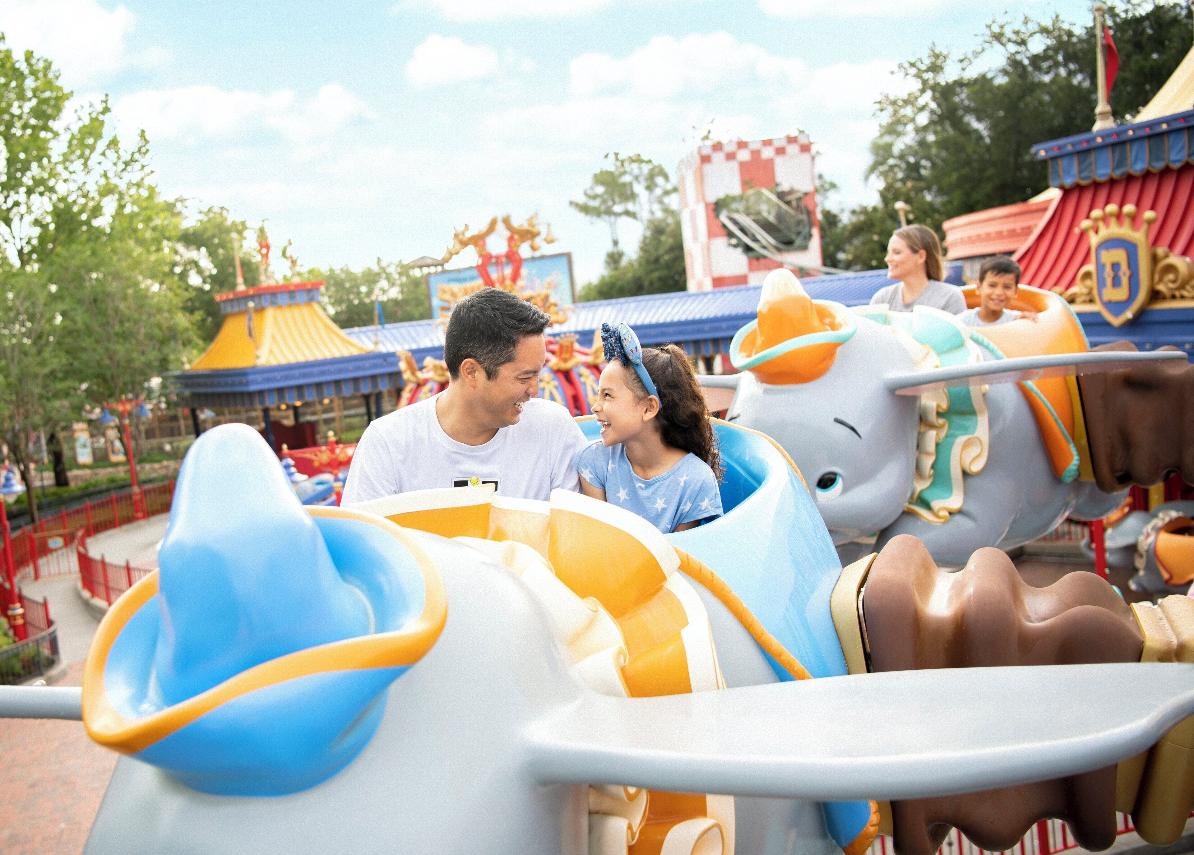 A theme park ride with a family.