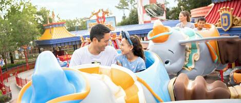 A theme park ride with a family.
