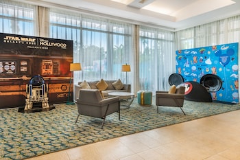 Sitting area in hotel lobby at Holiday Inn Orlando - Disney Springs® Area by IHG