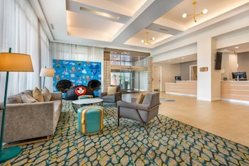 Hotel entrance and lobby at Holiday Inn Orlando - Disney Springs® Area by IHG