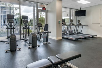 A grocery store with refrigerated sections and shelves stocked with various food items. at Holiday Inn Orlando - Disney Springs® Area by IHG