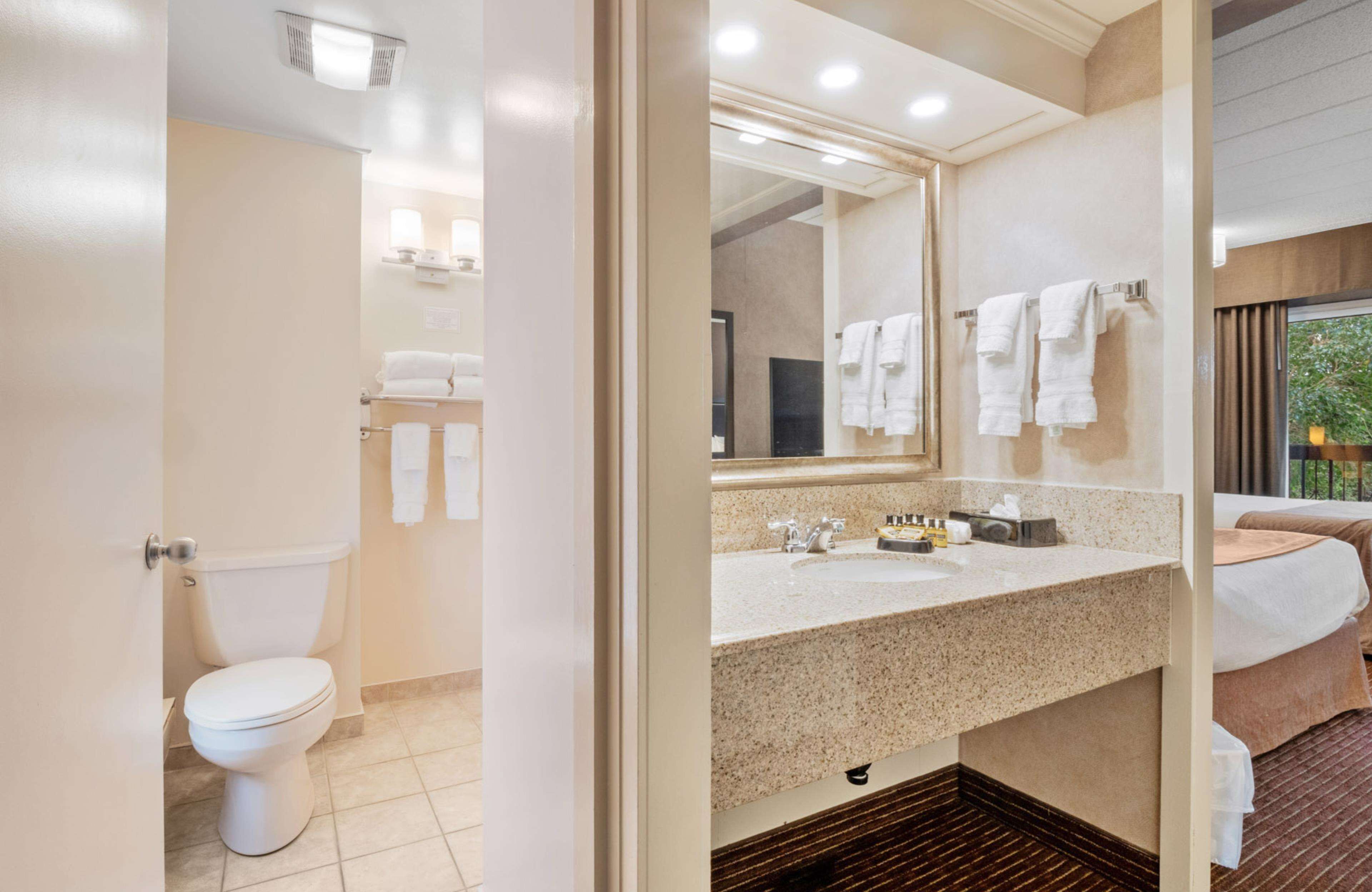 standard room, 2 queen beds, refrigerator, courtyard area | bathroom | combined shower/bathtub, free toiletries, hair dryer, towels