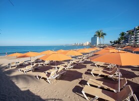 Free beach shuttle, sun loungers, beach umbrellas