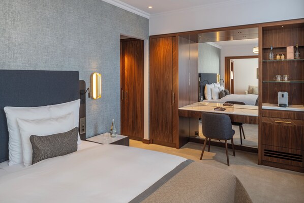 Premium bedding, down comforters, minibar, in-room safe