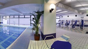 An indoor swimming pool with exercise equipment and a potted plant. - ANA Crowne Plaza Kyoto by IHG (Kyoto)