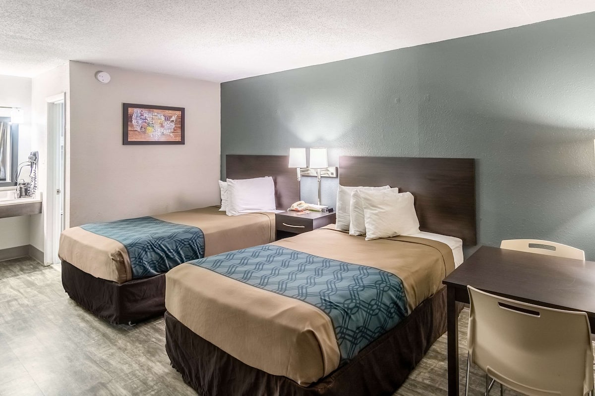 Desk, laptop workspace, blackout drapes, iron/ironing board