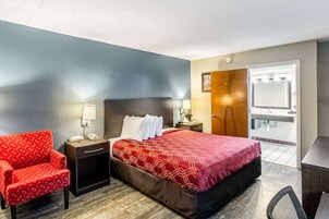 Desk, laptop workspace, blackout drapes, iron/ironing board