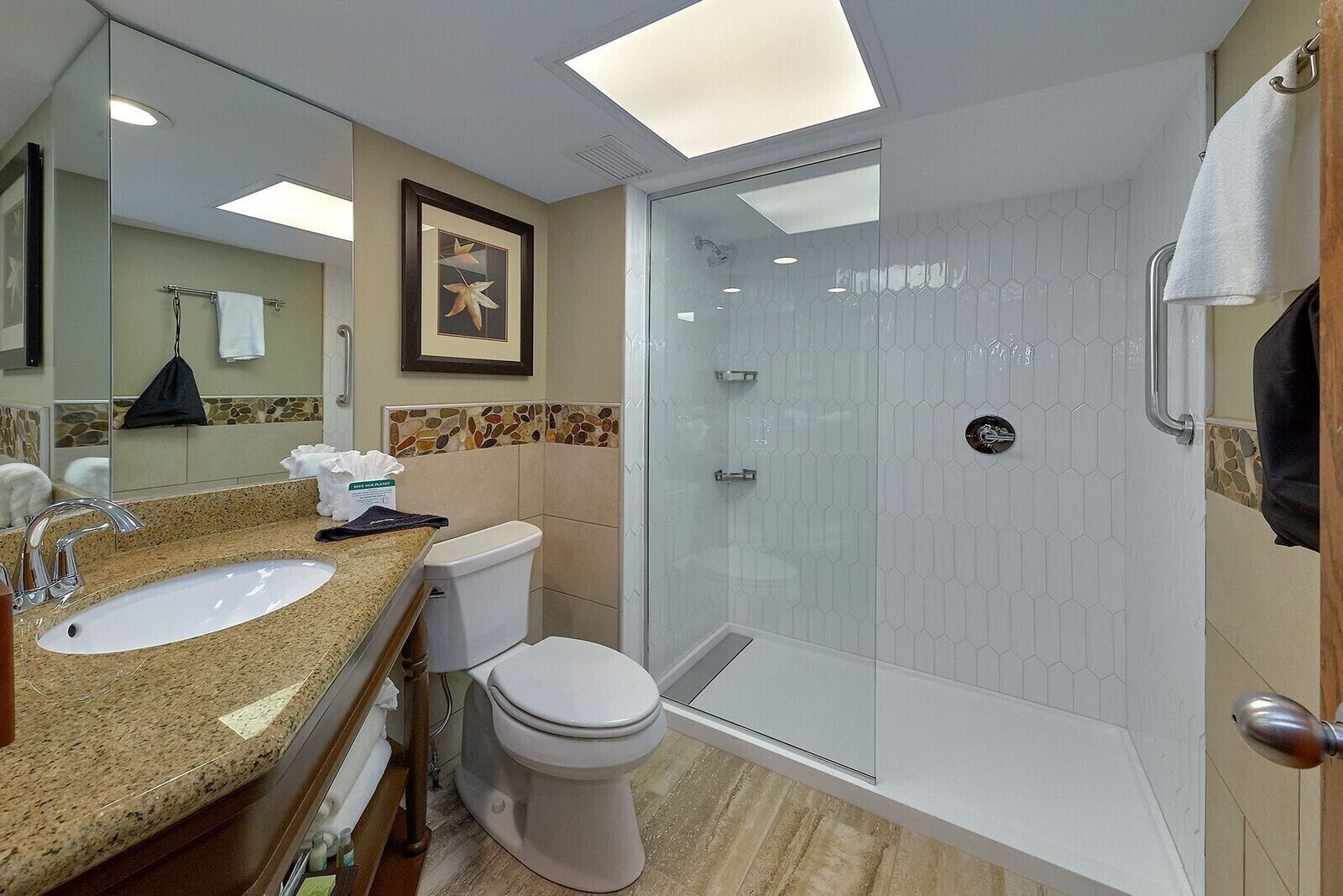 combined shower/bathtub, designer toiletries, hair dryer, towels